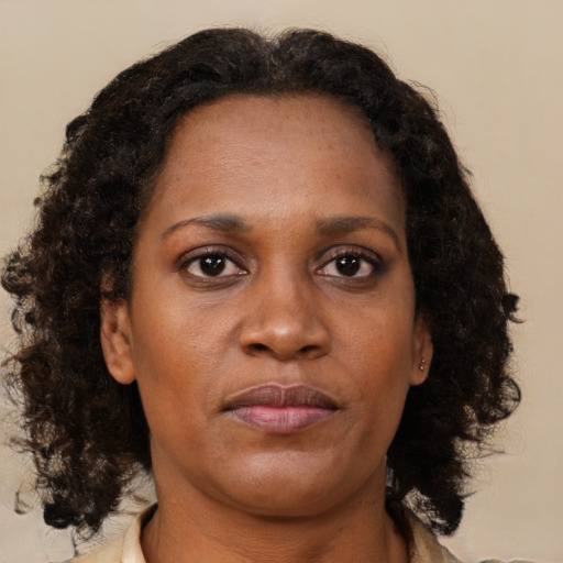Neutral black young-adult female with medium  brown hair and brown eyes