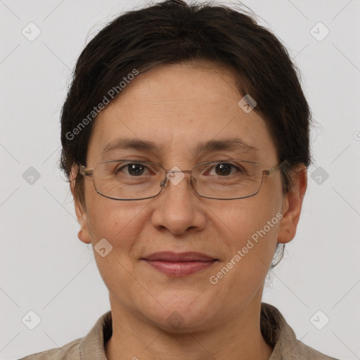 Joyful white adult female with short  brown hair and brown eyes