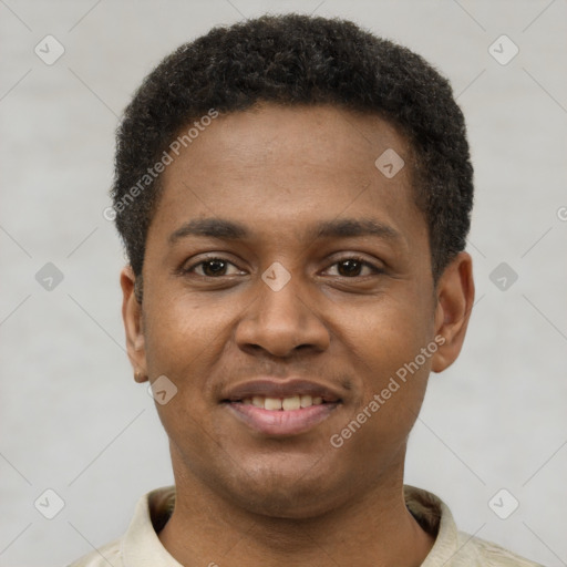 Joyful black young-adult male with short  brown hair and brown eyes