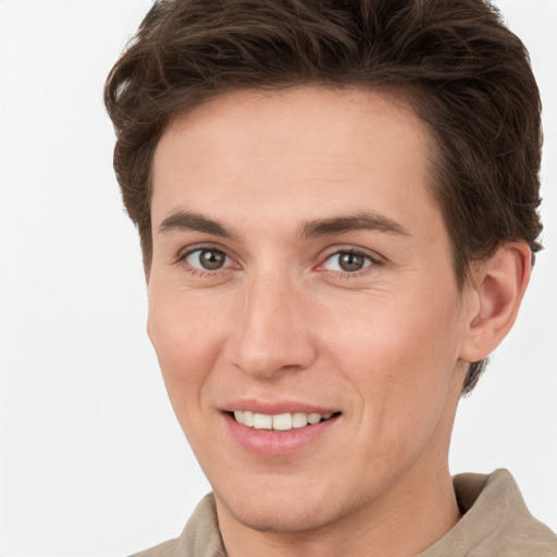 Joyful white young-adult female with short  brown hair and grey eyes