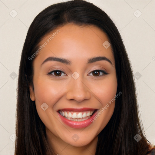 Joyful latino young-adult female with long  brown hair and brown eyes