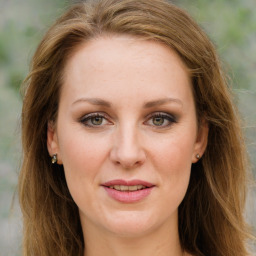 Joyful white young-adult female with long  brown hair and green eyes