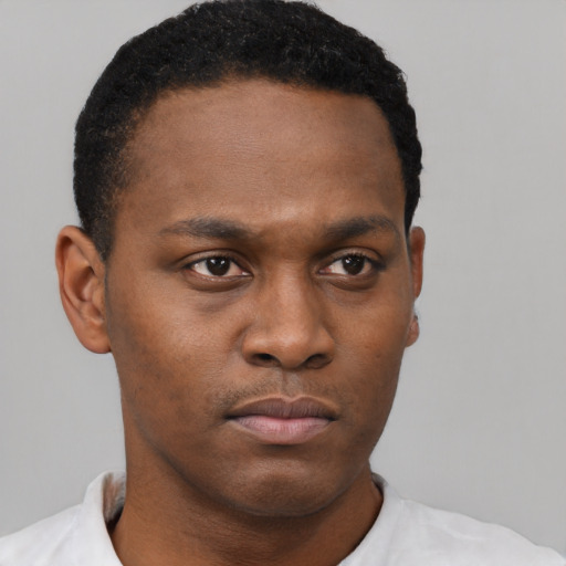 Neutral black young-adult male with short  brown hair and brown eyes