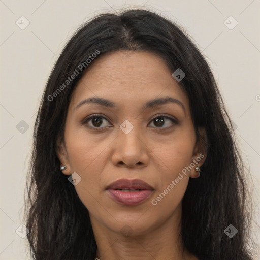 Joyful latino young-adult female with long  brown hair and brown eyes