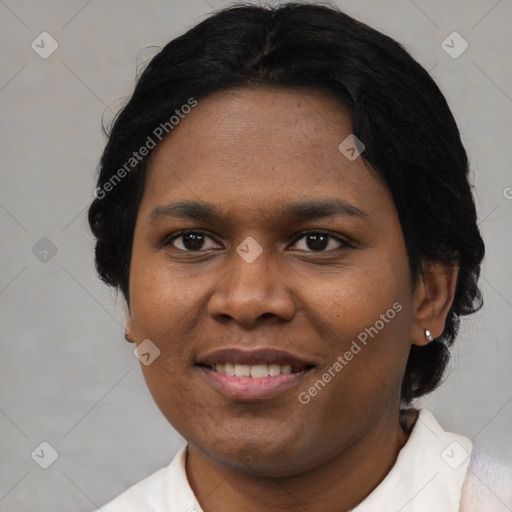 Joyful black adult female with short  brown hair and brown eyes