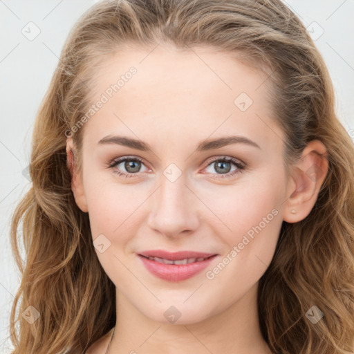 Joyful white young-adult female with long  brown hair and blue eyes