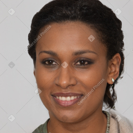 Joyful latino young-adult female with short  brown hair and brown eyes