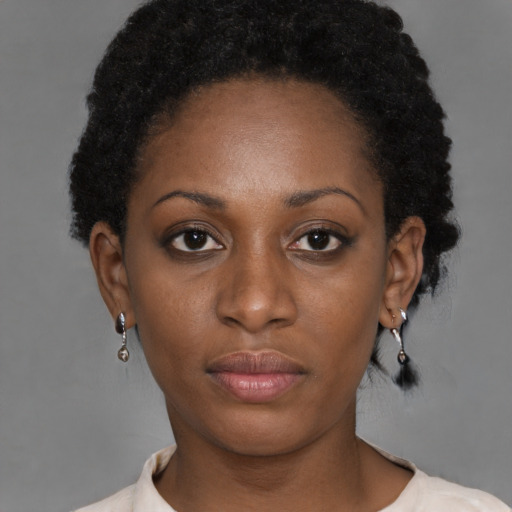Neutral black young-adult female with short  brown hair and brown eyes