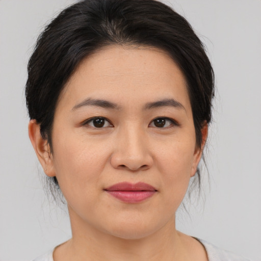 Joyful asian young-adult female with medium  brown hair and brown eyes
