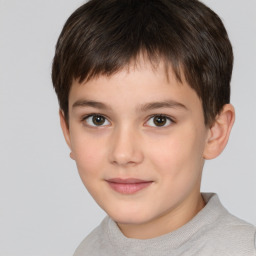 Joyful white child male with short  brown hair and brown eyes