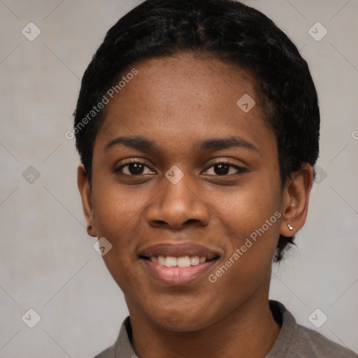 Joyful black young-adult female with short  black hair and brown eyes