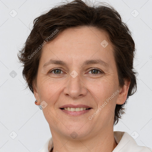 Joyful white adult female with short  brown hair and brown eyes