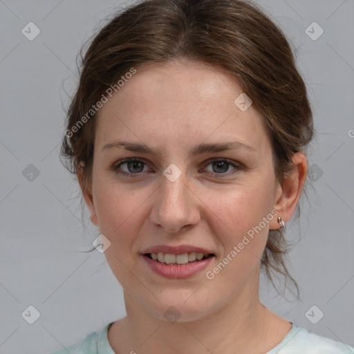 Joyful white young-adult female with medium  brown hair and blue eyes