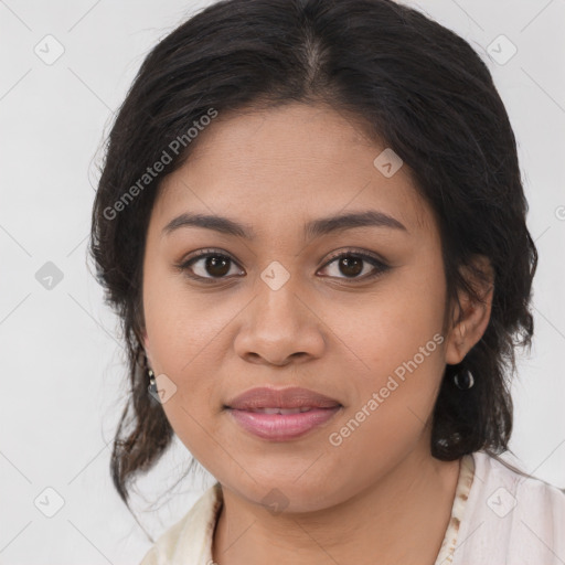 Joyful latino young-adult female with medium  brown hair and brown eyes