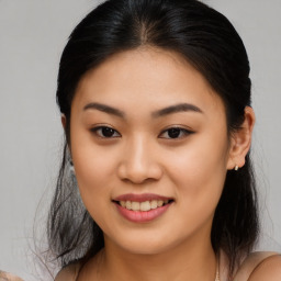 Joyful asian young-adult female with medium  brown hair and brown eyes