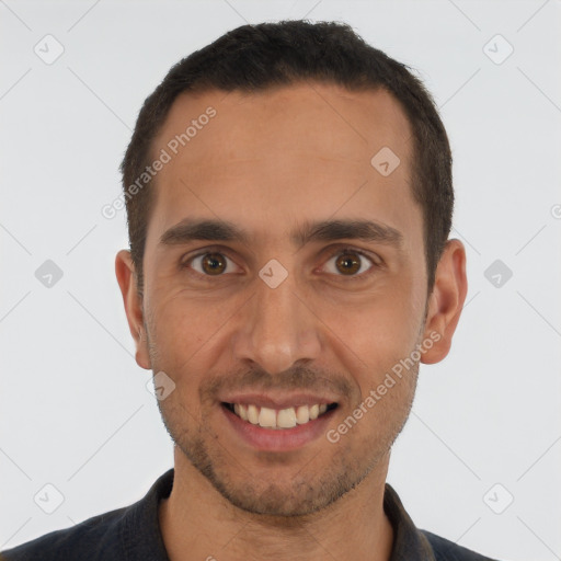 Joyful white young-adult male with short  brown hair and brown eyes