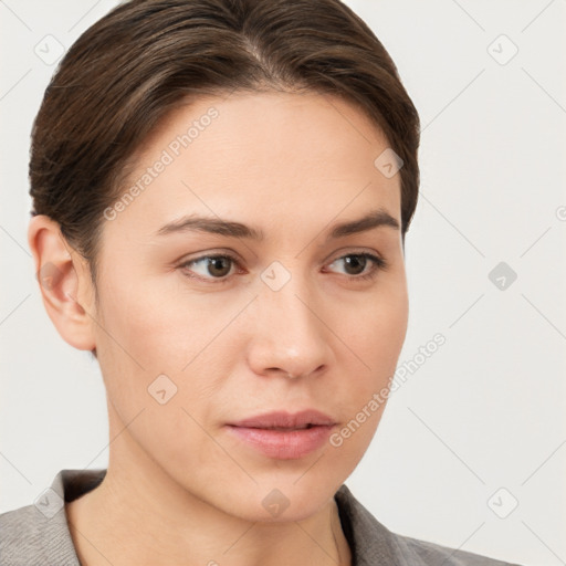 Neutral white young-adult female with short  brown hair and brown eyes