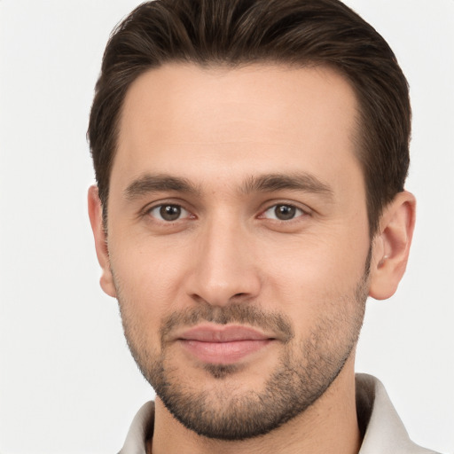 Joyful white young-adult male with short  brown hair and brown eyes