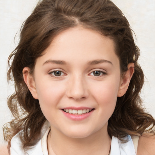 Joyful white child female with medium  brown hair and brown eyes