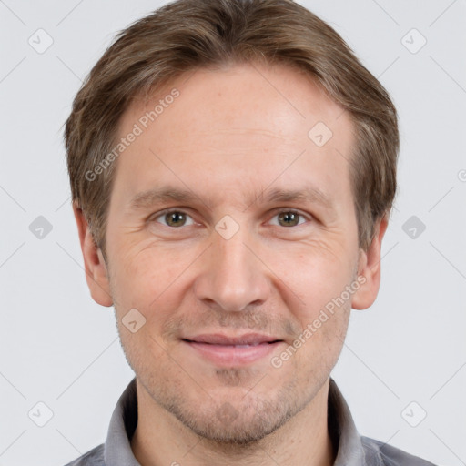 Joyful white adult male with short  brown hair and grey eyes