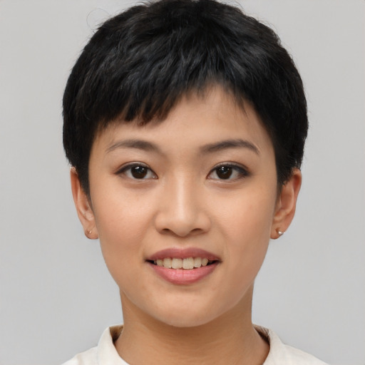 Joyful asian young-adult female with short  black hair and brown eyes