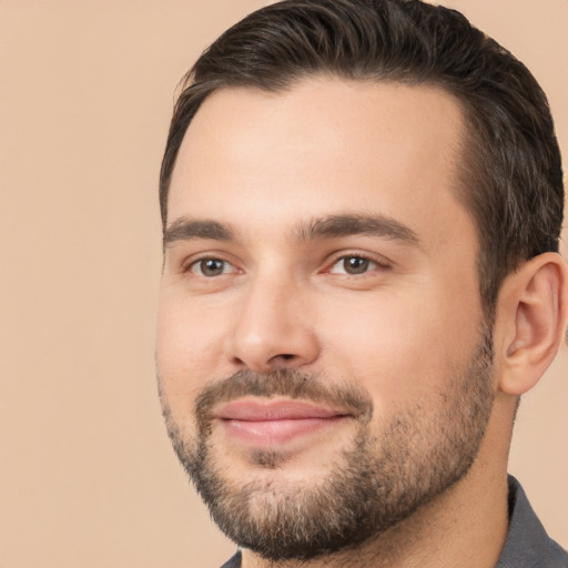 Joyful white young-adult male with short  brown hair and brown eyes