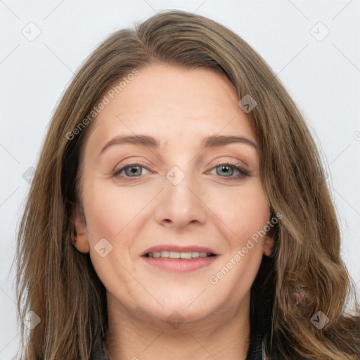 Joyful white young-adult female with long  brown hair and green eyes