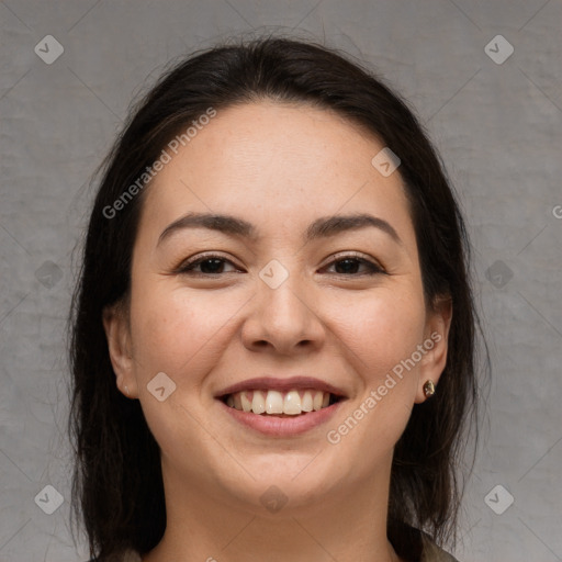 Joyful white young-adult female with long  brown hair and brown eyes