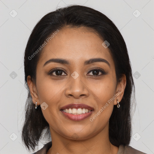 Joyful latino young-adult female with medium  brown hair and brown eyes