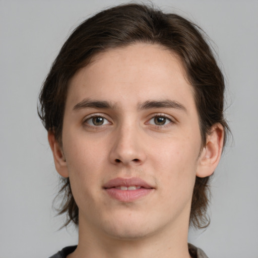 Joyful white young-adult male with medium  brown hair and brown eyes