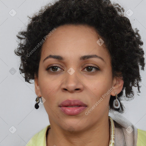 Joyful black adult female with short  brown hair and brown eyes