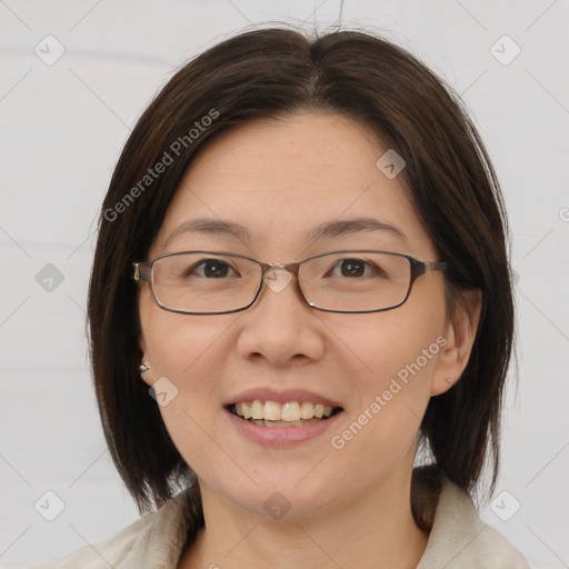 Joyful white adult female with medium  brown hair and brown eyes