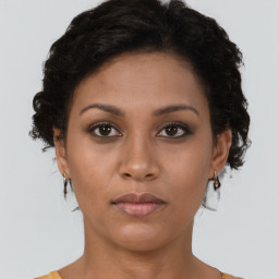 Neutral black young-adult female with short  brown hair and brown eyes