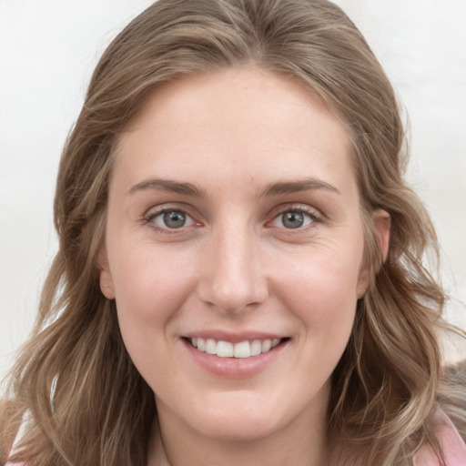 Joyful white young-adult female with long  brown hair and grey eyes