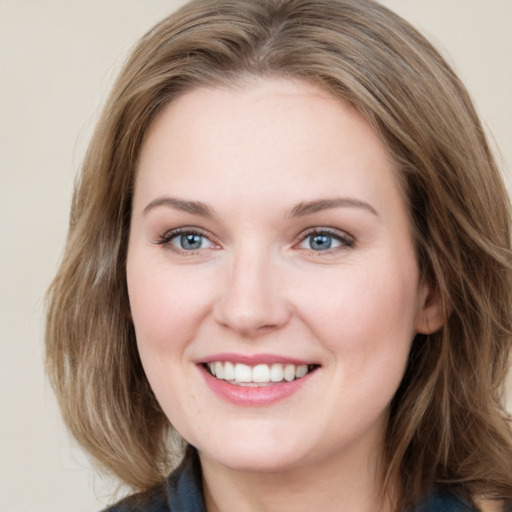 Joyful white young-adult female with medium  brown hair and blue eyes