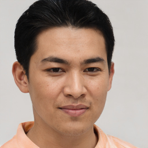 Joyful asian young-adult male with short  brown hair and brown eyes