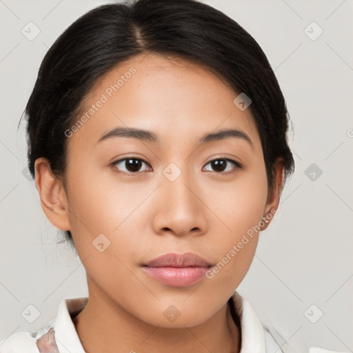 Joyful latino young-adult female with medium  brown hair and brown eyes