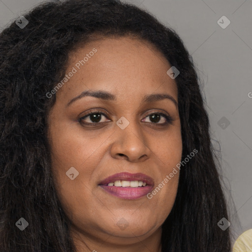 Joyful black young-adult female with long  brown hair and brown eyes