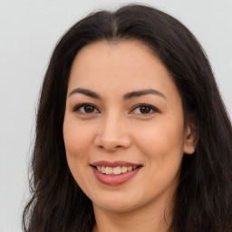 Joyful asian young-adult female with long  brown hair and brown eyes