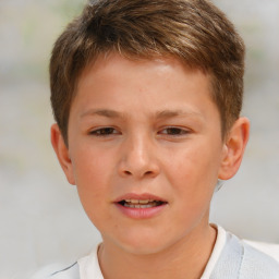 Joyful white child male with short  brown hair and brown eyes