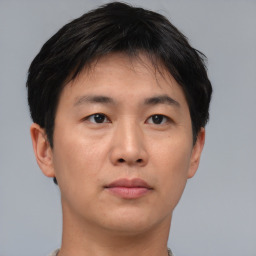 Neutral asian young-adult male with short  brown hair and brown eyes