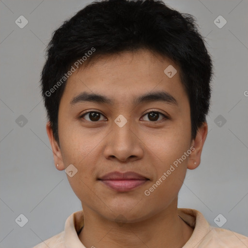 Joyful latino young-adult male with short  black hair and brown eyes