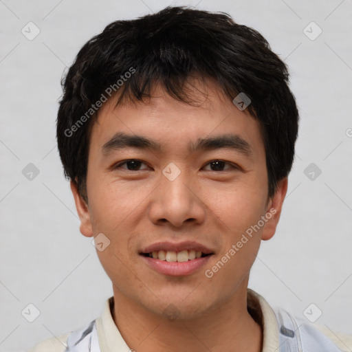 Joyful asian young-adult male with short  black hair and brown eyes