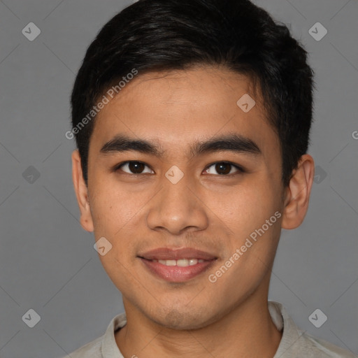 Joyful latino young-adult male with short  brown hair and brown eyes