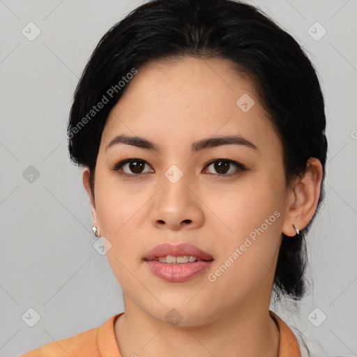 Joyful asian young-adult female with medium  black hair and brown eyes