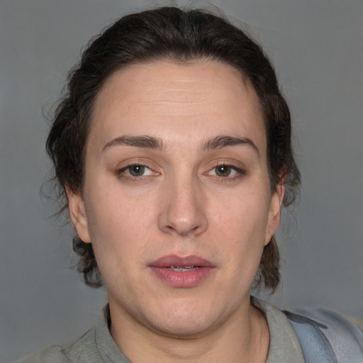 Neutral white adult female with medium  brown hair and brown eyes