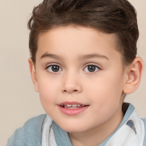 Joyful white child male with short  brown hair and brown eyes