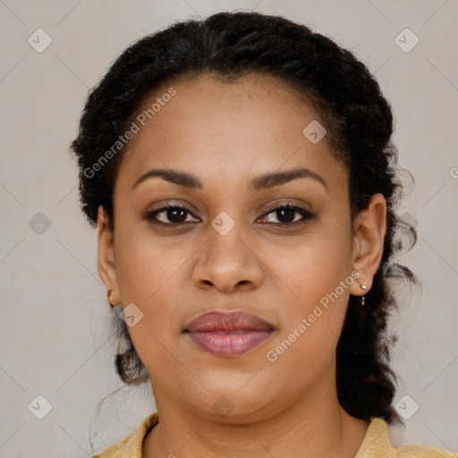 Joyful black young-adult female with medium  brown hair and brown eyes