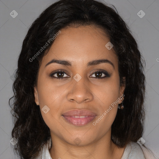 Joyful black young-adult female with long  brown hair and brown eyes