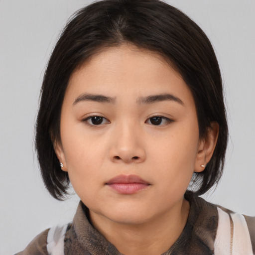 Neutral asian young-adult female with medium  black hair and brown eyes